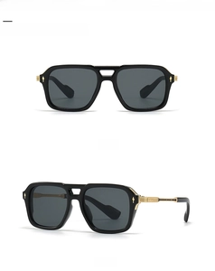 Detail view of square aviator sunglasses with black gold double-bridge frame and hinges