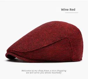 Detail view of wine red herringbone tweed newsboy cap with classic retro texture