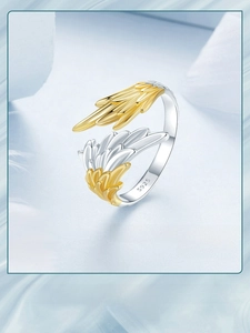 Close-up of S925 silver wing ring showing inner hallmark and two-tone gold plating