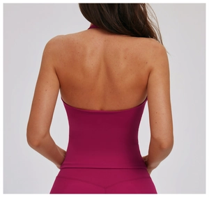 Detailed back view of a magenta halter neck yoga vest featuring an open back design