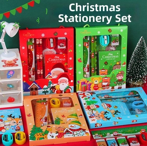 Close-up of Christmas stationery set with pencils, ruler, and eraser in festive gift boxes