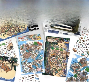 Detail showing 2.5D isometric scenery stickers placed near a laptop and stationery