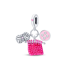 Detail of knitting charm with pink enamel yarn ball and sewing machine pendants