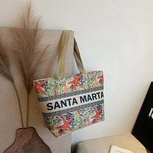Detail of the high-capacity linen tote with starfish print and woven logo band