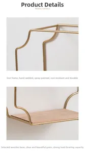 Detail of golden iron wall shelf with solid wood base and handmade welding joints