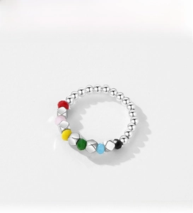 Close-up of S925 sterling silver beaded ring with colorful faceted beads in pop style