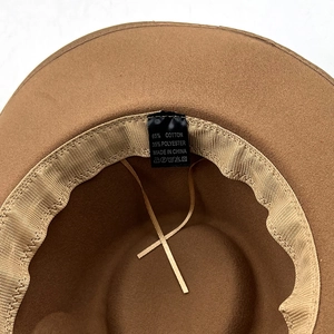 Detail shot of brown wool fedora interior featuring cotton sweatband and size label