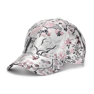 Close-up of intricate cherry blossom and bird embroidery on gray baseball cap fabric