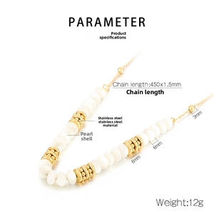 Detailed close-up of beaded necklace with white shell pearls and gold stainless steel beads