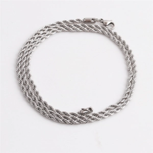 Macro detail of a silver twisted rope chain featuring a secure lobster clasp closure