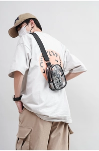 Rear view of model wearing a clear PVC crossbody bag with black strap and Gengar design