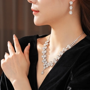 Exquisite silver sunflower jewelry set with sparkling rhinestones on an elegant model