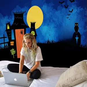 Detail of Halloween tapestry with moon and castle silhouette behind a lifestyle scene