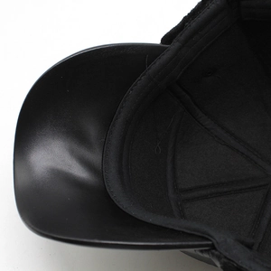 Detail view of leather brim craftsmanship and soft lining on men winter trapper hat