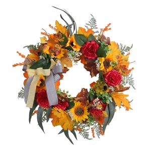 Ghirlanda autunnale con girasoli foglie d'acero e fiocco per decorazione della porta