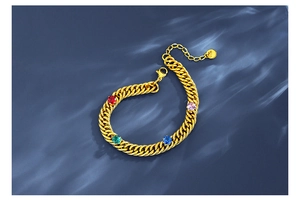 Close-up of gold chain bracelet with colorful round zircons and S925 engraved tag