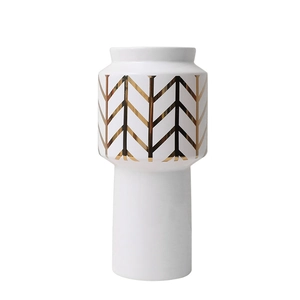 Modern white ceramic vase with golden V-shaped geometric pattern for elegant home decor