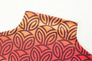 Detailed close-up of high neck collar with geometric warm gradient pattern on mini dress