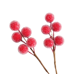 Red frosted artificial Christmas berry stems with white snowy texture on white backdrop