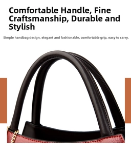 Detail of dark brown leather handles and gold metal chain on a retro crocodile handbag