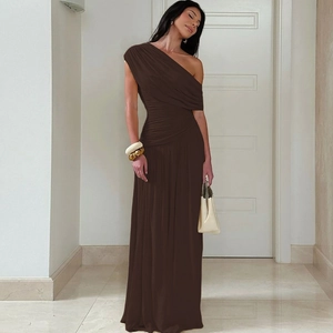 Detailed view of the brown off-shoulder dress featuring ruched fabric and sleek texture