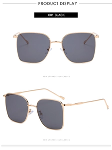 Detail view of square metal frame sunglasses with black lenses and gold finish