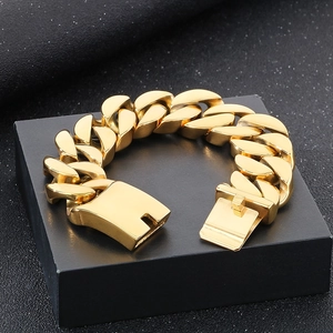 Chunky 22mm polished gold stainless steel Cuban link bracelet for men on a black gift box
