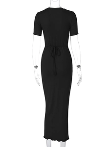 Detail of slim fit ribbed black maxi dress featuring a stylish lace-up back design