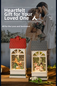 Close-up of vintage Christmas lanterns with snow globe scenes and warm LED lighting
