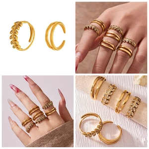 Detail view of gold double layer rings and zircon wheat ear band in a lifestyle set