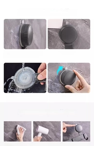 Detail view of suction cup hook installation steps and maintenance guide on marble wall