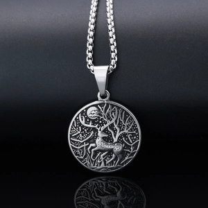 Round vintage stainless steel necklace featuring embossed reindeer and forest design