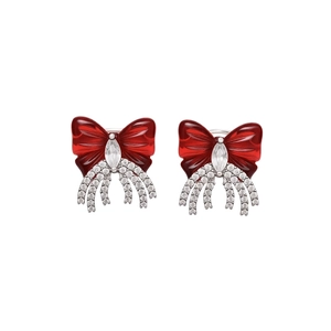 Elegant red bow ear cuff with sparkling zircon and silver tassels on white background