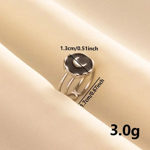 Detailed view of silver crescent moon ring showing 1.3cm face and 1.7cm adjustable band