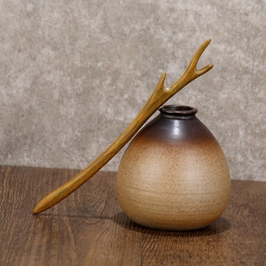 Handcrafted green sandalwood hair pin in natural Y-shaped branch design with wood grain