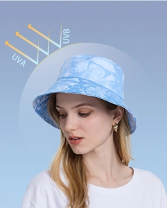 Detail of light blue tie-dye bucket hat providing UVA and UVB sun protection
