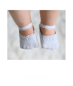 Detail of infant lace trim boat socks in soft blue-grey knit fabric with elastic band
