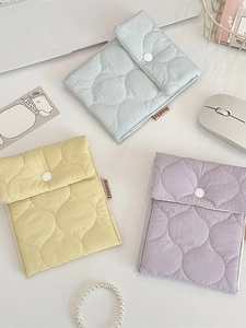 Set of three quilted mini cosmetic bags in blue purple and yellow macaron colors