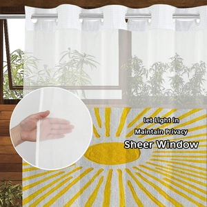 Detail of semi-transparent waffle sheer curtain featuring bright yellow sunburst pattern