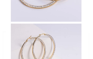 Macro view of gold plated square hoop earrings with sparkling cubic zirconia inlay detail