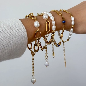 Gold layered stainless steel bracelet set with freshwater pearls and blue bead accents