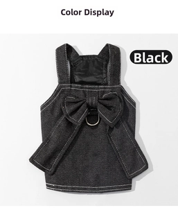 Detail of black denim dog dress featuring white contrast stitching and a bow with D-ring
