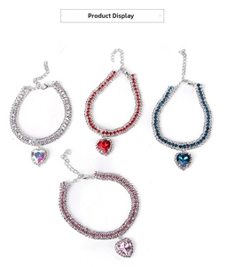 Detailed view of adjustable heart pendant pet necklaces in four vibrant rhinestone colors