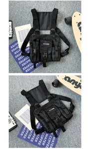 Tactical chest bag with nylon straps and TOYLI-BAG woven label on a street style background