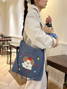 Navy blue striped canvas tote bag with cute puppy embroidery and shoulder strap