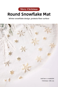 Detail of white plush Christmas tree skirt featuring golden sequined snowflake embroidery