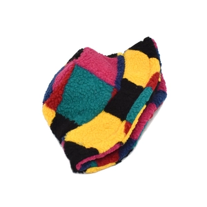 Thick winter bucket hat with colorful patchwork design in warm faux lamb wool fabric
