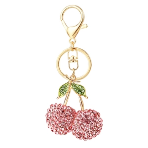 Portachiavi con ciliegie scintillanti, strass rosa e foglie in smalto verde dorato