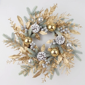 Detail of Christmas wreath with golden leaves, silver berries, and pine cones