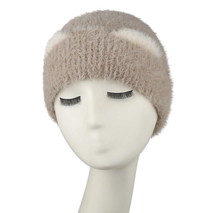 Close-up of soft fuzzy knit cat ear beanie showing plush faux fur texture in beige